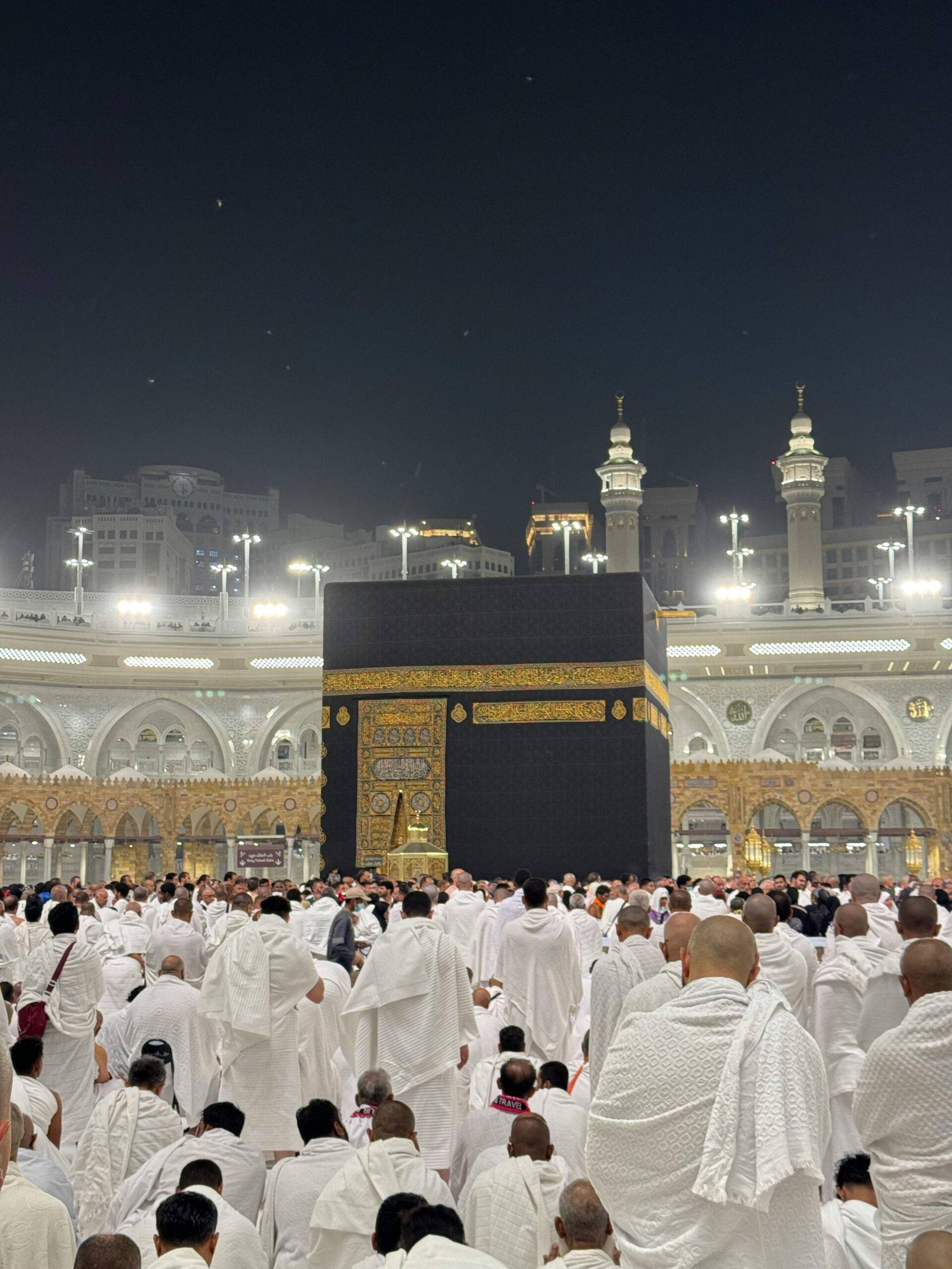 Pilgrims gather for prayer around the Kaaba in Mecca, Saudi Arabia during Hajj at night.